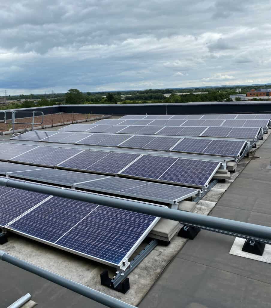 A large group of solar panels on the roof of a business premises in Oxfordshire